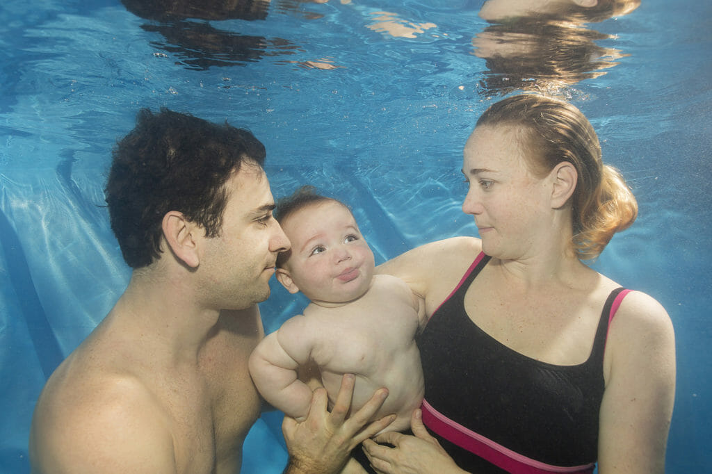 parents swimming with child home visit lessons exclusive development