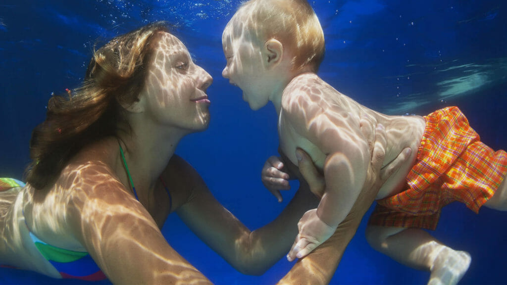 mother and child swimming together