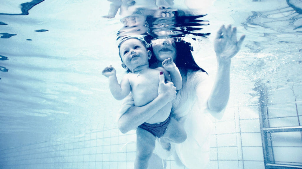 stock photograph mother and child swimming