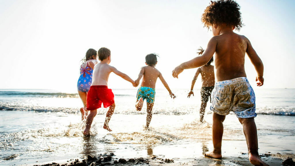 children running on a beach